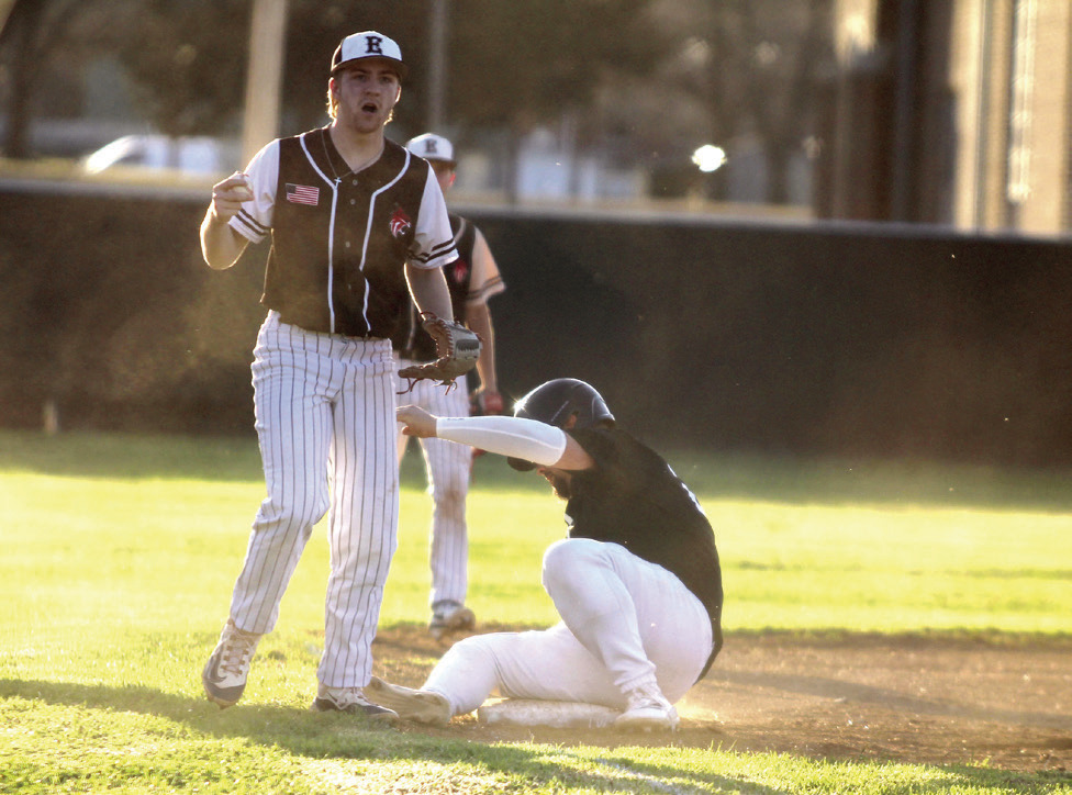 Earlsboro's Jon Wilkins plays third base after Jesse Siqueiros, on the Maud/Macomb co-op team, slid into the base on March 11. Natasha Dunagan, Countywide &amp; Sun