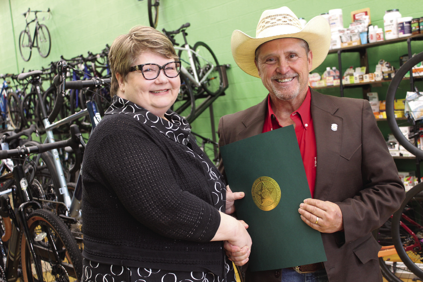 Oklahoma State Representative Danny Sterling, right, presents a citation of recognition on behalf of the Oklahoma House of Representatives to Mary Carter, of Tecumseh, during a reception at SpOKeLAHOMA on May 3. Carter was inducted into the Oklahoma Journalism Hall of Fame on May 2 at the University of Central Oklahoma. Sterling read the citation aloud before presenting it. He said Carter began working for the Countywide News at age 15, performing various jobs in the office. 