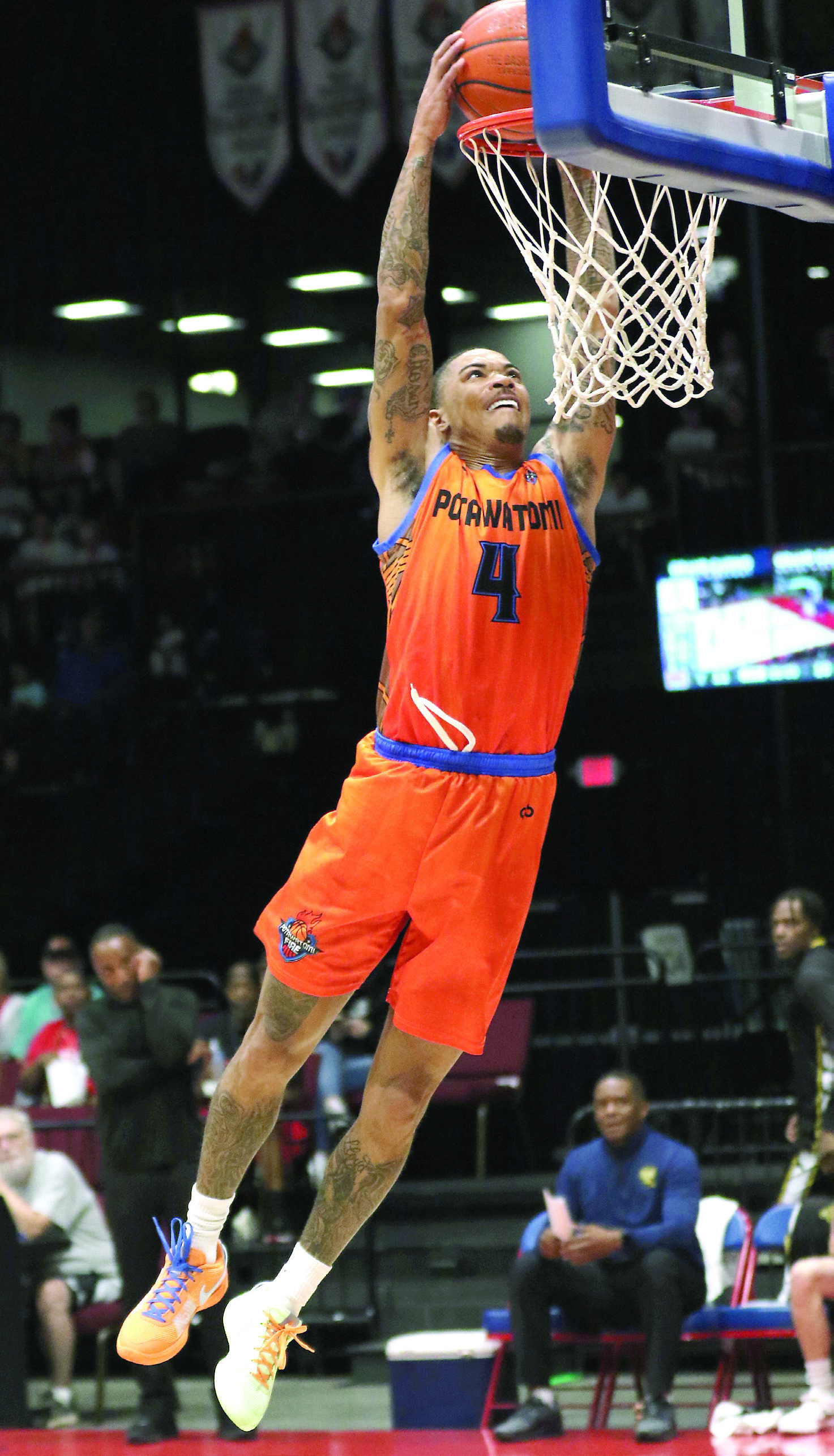 Potawatomi Fire Guard Chuck Guy makes a slam dunk in their last regular season game on May 24. The Fire beat Creating Young Minds (CYM), 133-97, with Guy contributing 27 points, according to potawatomifire.com. Photo courtesy of Kent Bush