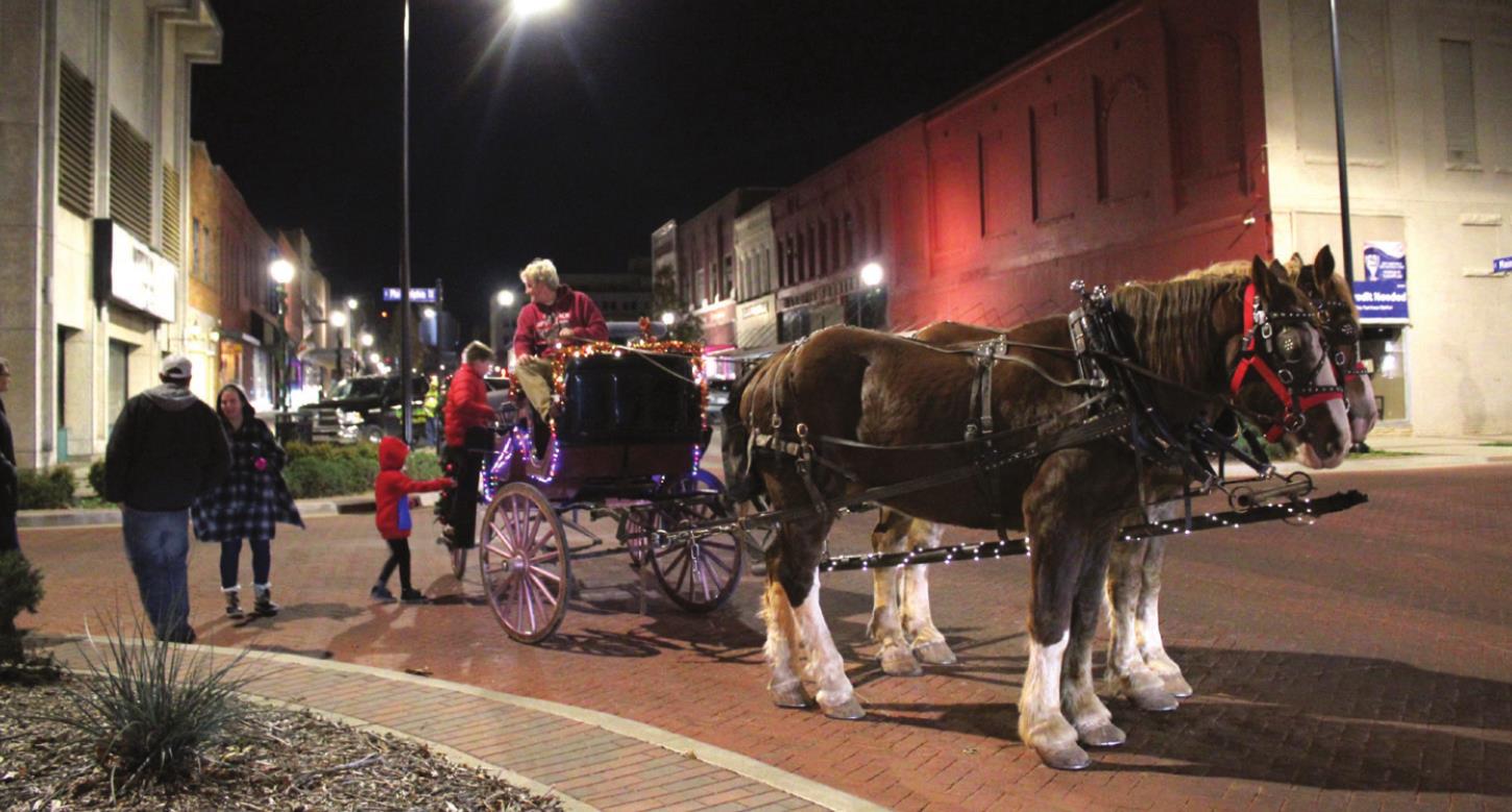 Passengers climb aboard the Spirit Coach