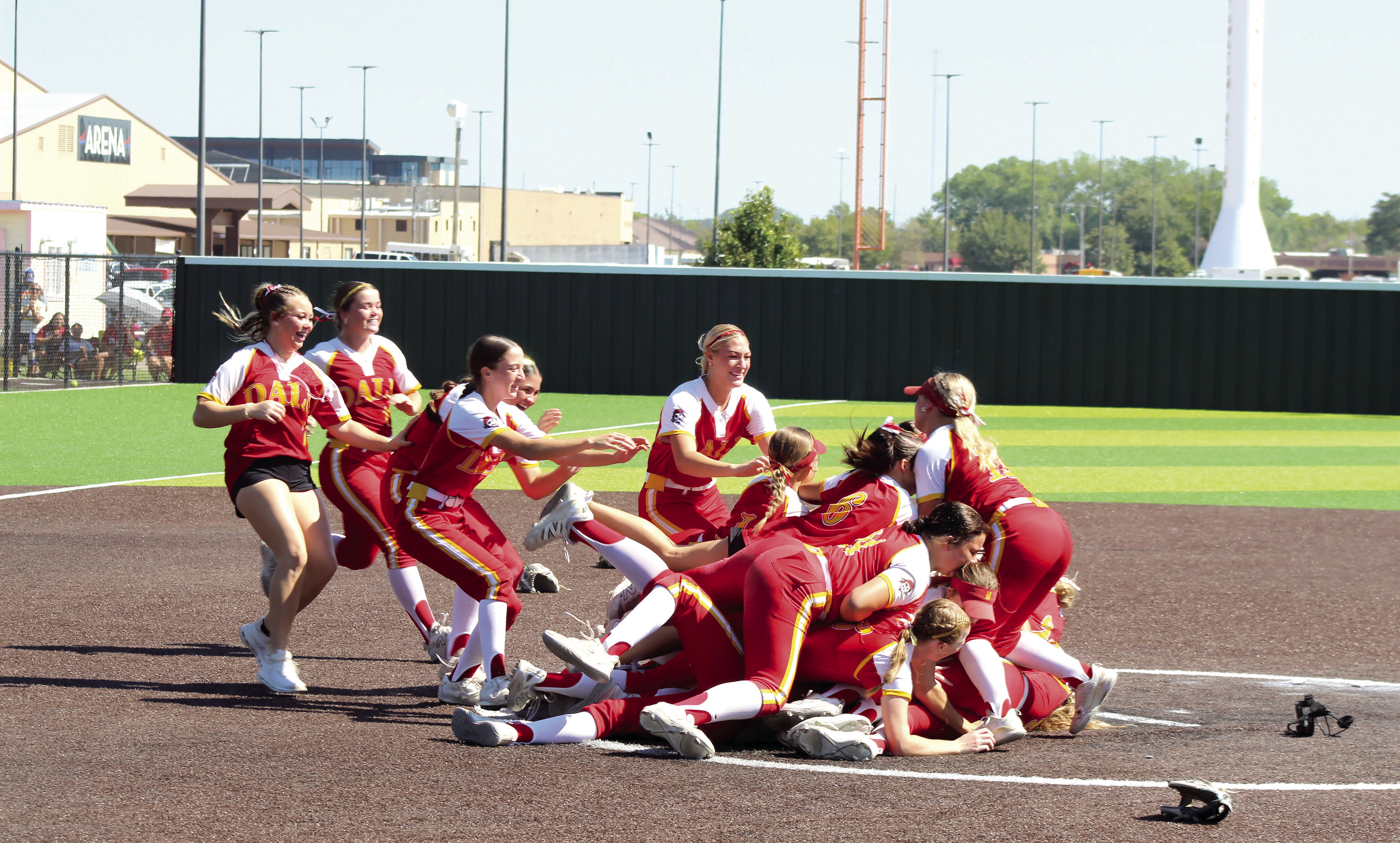 The Dale Lady Pirates Fast Pitch team celebrate with a dogpile after getting the third out in the eighth inning of the Class 2A Fast Pitch State Championship at FireLake Ball Fields on Oct. 10. The Lady Pirates conquered Crescent, 11-2, in the quarterfinals on Oct 8; were victorious over Vanoss, 5-4, on Oct. 9; and won over Warner in the Championship, 4-2, in an extra inning. They end the season with a record of 39-4. See more photos under the Sports tab. Natasha Dunagan, Countywide & Sun