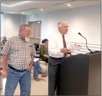 Shawnee Veteran’s Memorial Park Committee Chairman Bill Ford addressed the Board of County Commissioners about a potential Veteran’s Military Museum and Library to be housed in the Carnegie Library (the former District Attorney’s Office). James Bryce stands with Ford as well as other Veterans and Committee Members in the audience. Countywide &amp; Sun/Suzie Campbell