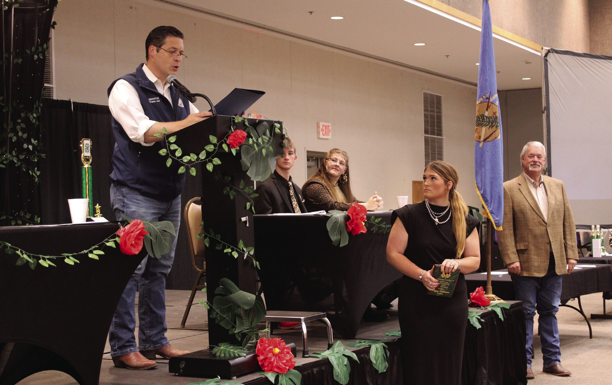 After Randy Gilbert, far right, presented Poppy Robinson with the 4-H Outstanding Senior Award, Oklahoma State Senator Shane Jett read a Citation of Congratulations during the Pottawatomie County 4-H Awards Banquet on Oct. 27 at the Heart of Oklahoma Expo Center. Robinson is a freshman at Oklahoma State University and member of Dale 4-H Club. Natasha Dunagan, Countywide &amp; Sun