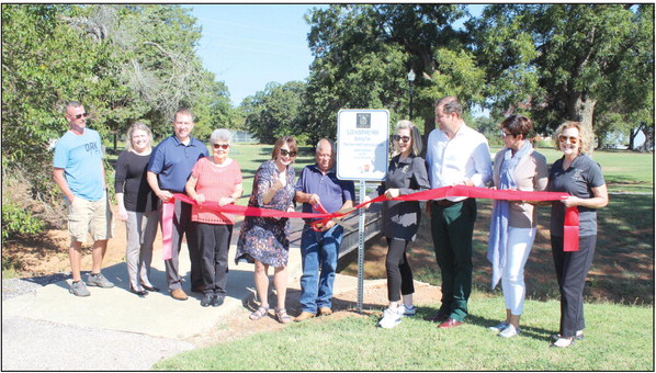 A ribbon is cut by Tecumseh City Manager Jimmy Stokes