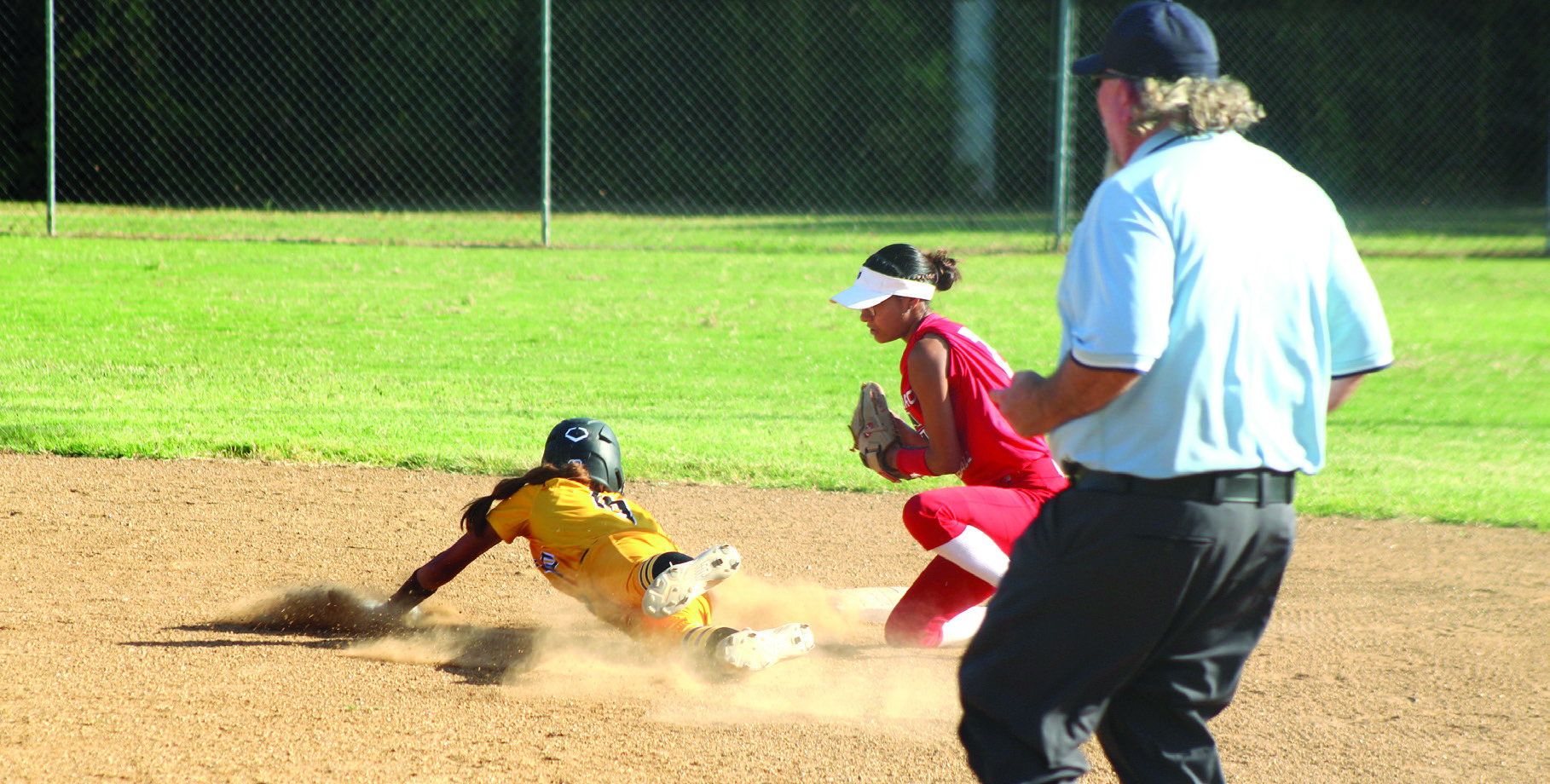 Earlsboro senior Molli Bustos guards second base as a Roff runner dive towards it during the first inning of the Aug. 13 home game. The Lady Wildcats lost 0-15. Photos by Natasha Dunagan, Countywide & Sun