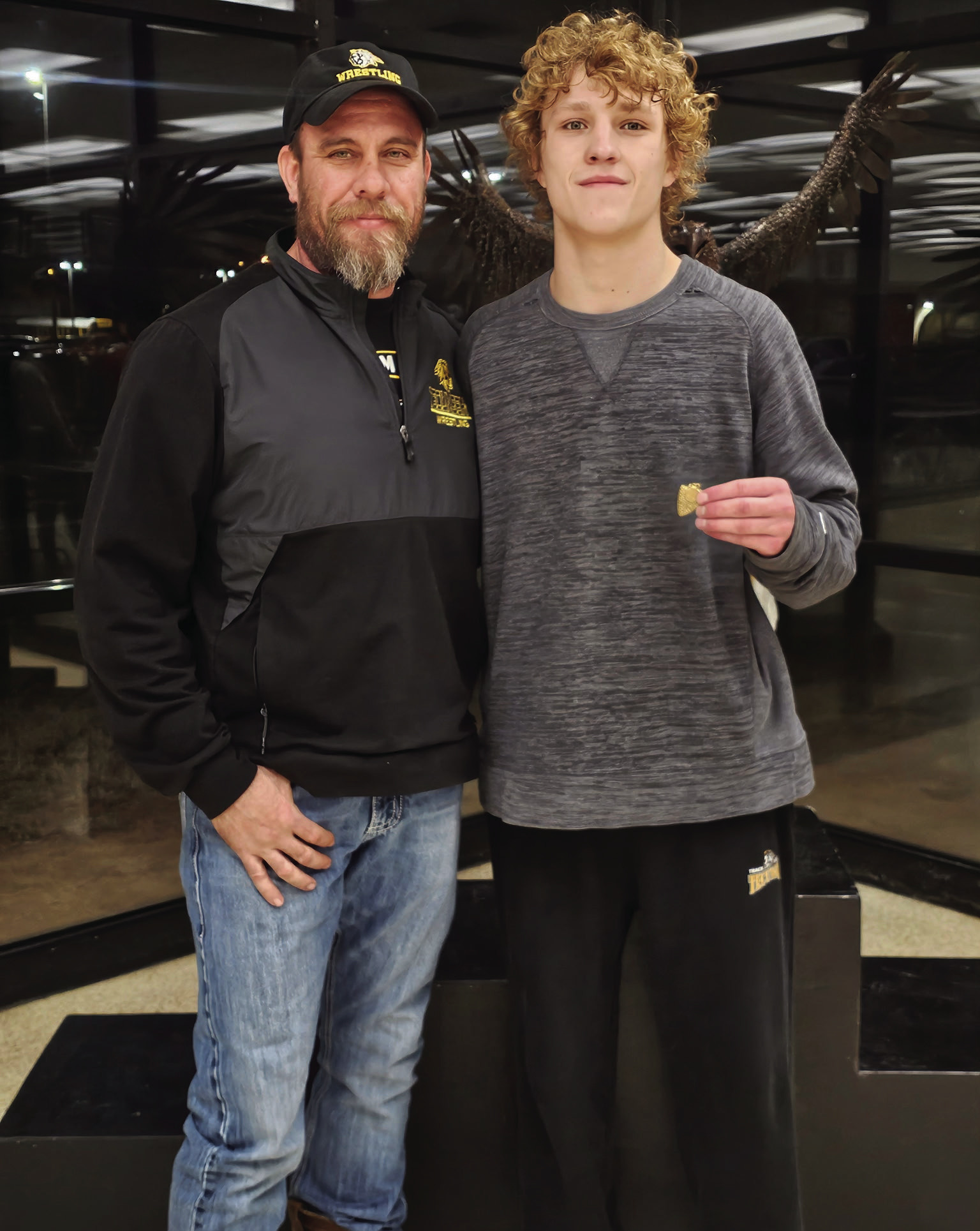 Tecumseh grappler Nick White, shown with Coach Billy Don Sigman, placed fourth in regionals and qualified for state in boys wrestling. Photo provided