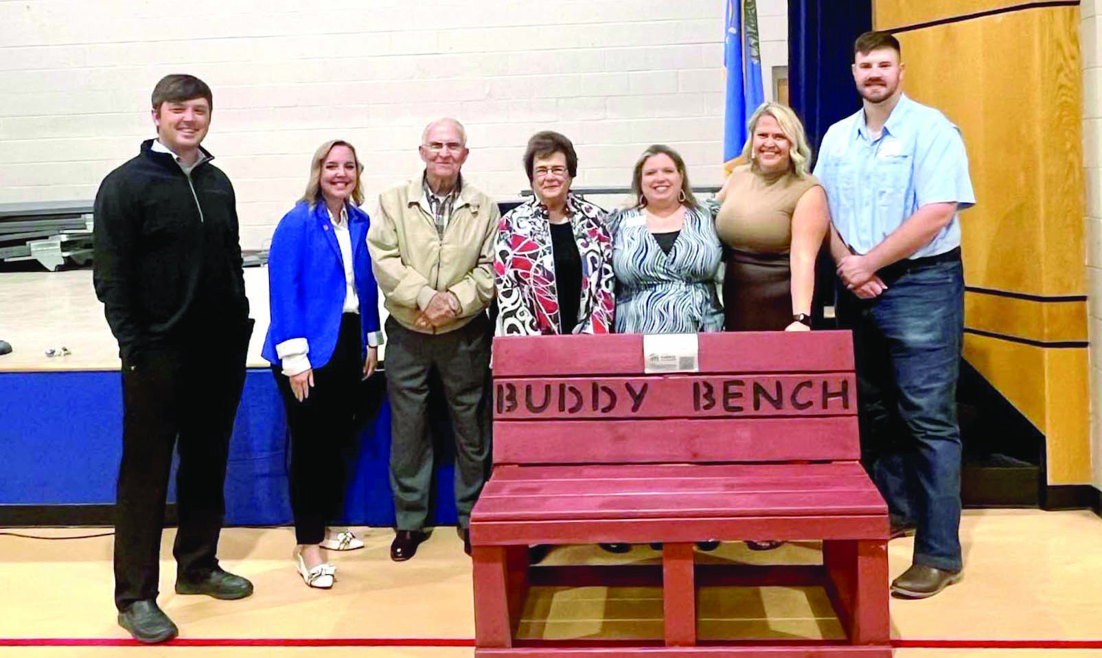 Members of Leadership Shawnee class with Bill and Nancy Ford deliver a Buddy Bench to Jefferson Elementary. Pictured from left are David Dinsmore, Kat Franklin, Bill Ford, Nancy Ford, April Grant (Habitat for Humanity), Jessica Nickerson and Vince Brackett. Photo provided by SPS