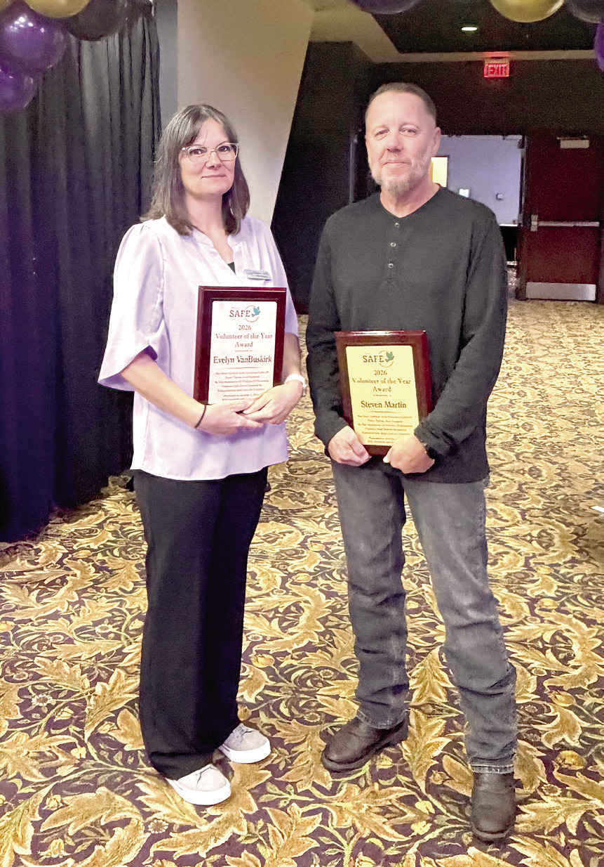 Evelyn VanBuskirk (left) and Steven Martin were presented with the 2026 Volunteer of the Year Awards at the 18th Annual Honey Do Auction. Suzie Campbell, Countywide &amp; Sun