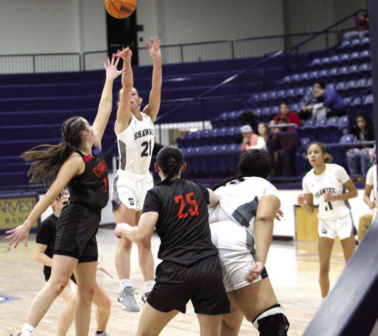 Shawnee senior Josie Megehee tries for three points in the Shawnee Invitational game with Coweta on Jan 24. The Lady Wolves beat Crooked Oak on Jan. 23, 62-19, lost to Coweta, 49-55, and fell to El Reno, on Jan. 25, 34-45. Countywide & Sun/Jessica Jones