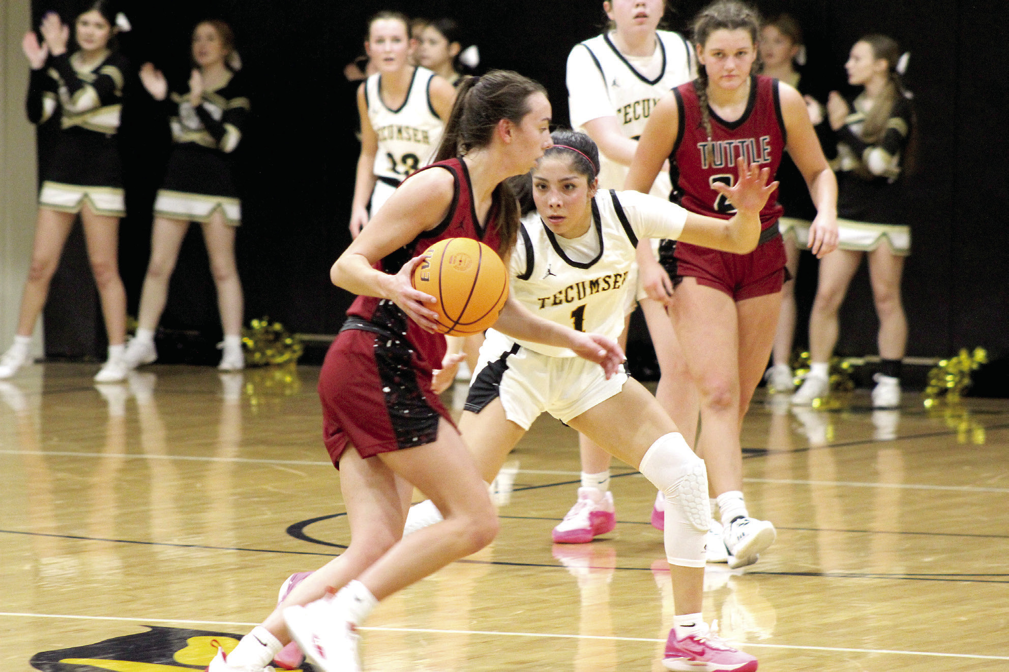 Tecumseh senior Serenity Jacoway keeps her eyes on the ball while on defense during the first home game against Tuttle, Nov. 28. The Lady Savages lost, 26-46. The Savages also lost, 62-72.