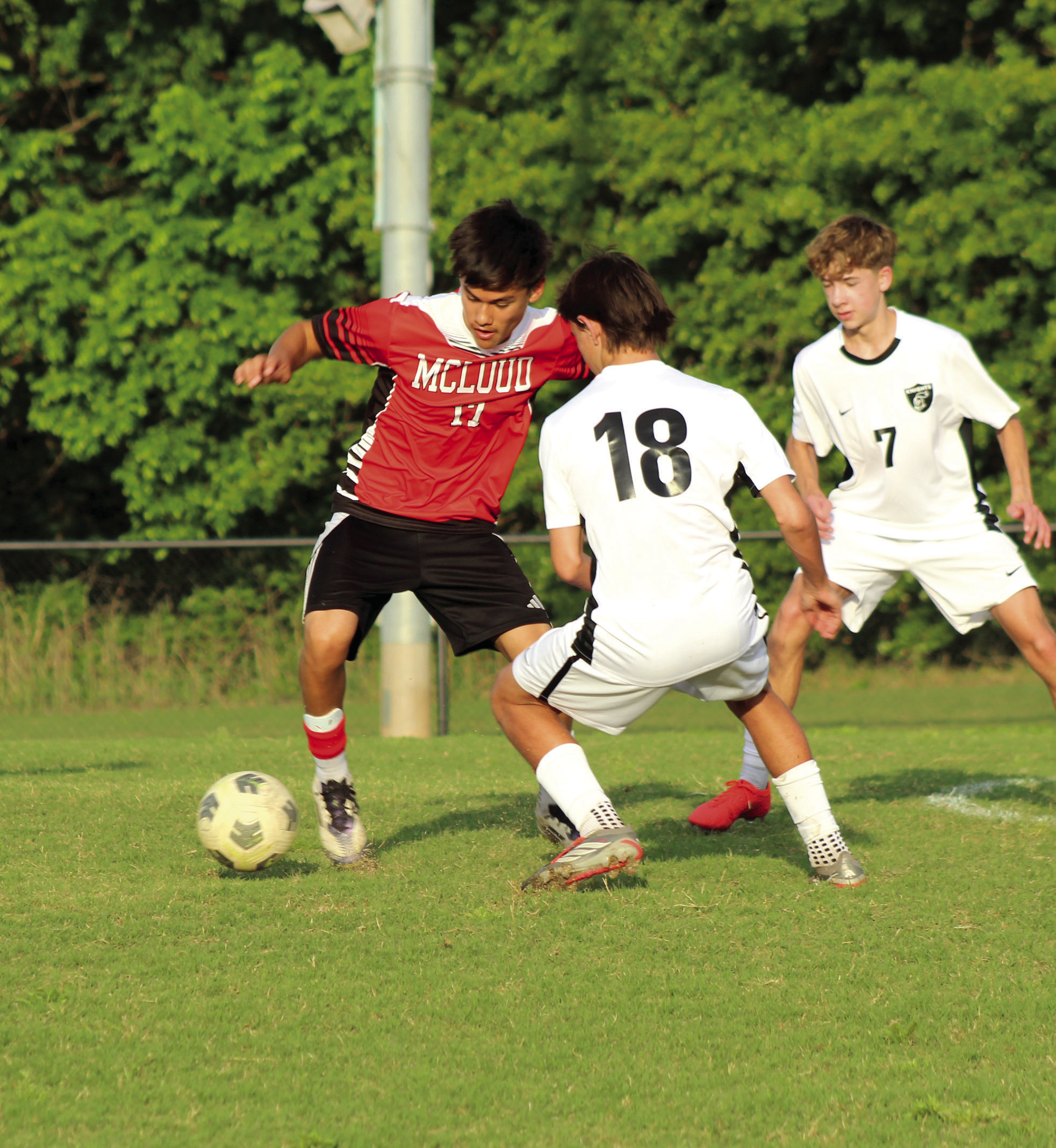 McLoud's Kristian Lujan maneuvers around the Crossings Christian defense during the April 16 home soccer match. The Redskins lost 0-7. Photos by Natasha Dunagan, Countywide & Sun