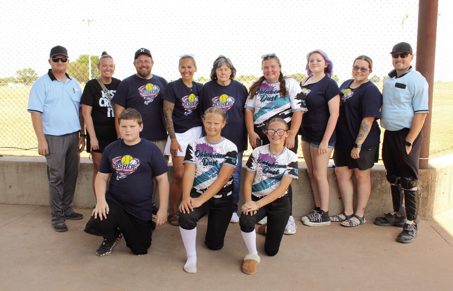 Tyler and Samantha Gensman and their whole family have renovated and managed the Asher Sports Complex, located at 38083 Old Highway 18, for the last 10 months. They hosted a softball tournament, Aug. 29-30. Shown, back row from left, are Chris Watson, S. Gensman, T. Gensman, Michelle Watson, Theresa Alexander, Raeyleigh Gensman, Nadaleigh Gensman, Patricia Pahdocony, Jay Scoggins, front row, Abel Stelzer, Maddox Watson and Karleigh Gensman. Photos by Natasha Dunagan, Countywide & Sun