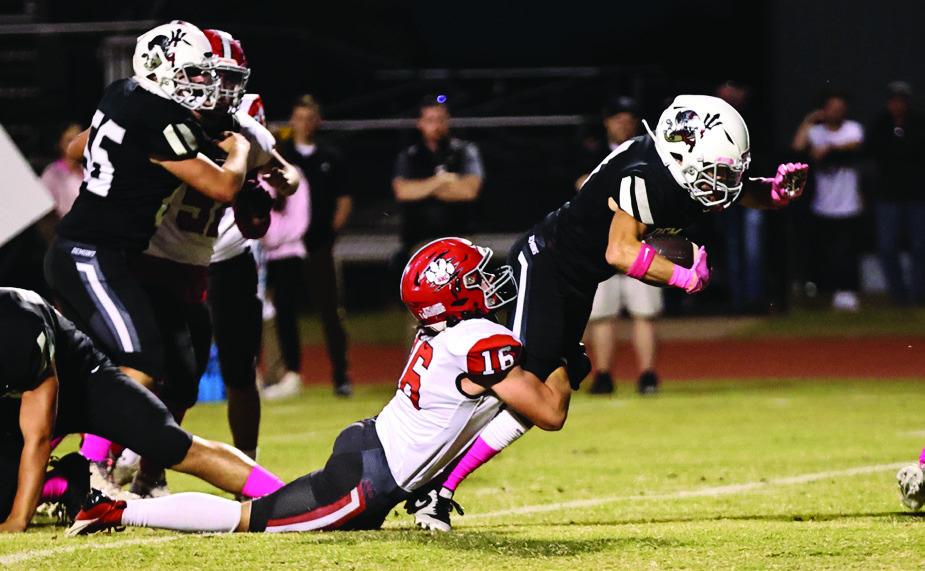 North Rock Creek’s Ethan Nowakowski makes the tackle to stop a touchdown. The Cougars came up short against Perkins-Tyron. 44-7. They need one more win to make the playoffs. They will play Kingfisher at home tomorrow, (Friday, Oct. 27). Photo courtesy of Gowin Photography