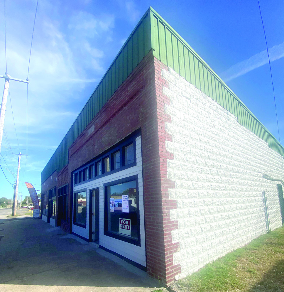 The most westward stop on the Empty Buildings Tour was the former Greens Corner, now remodeled and ready for new business. One of the two available rentals in this location was leased during the tour.