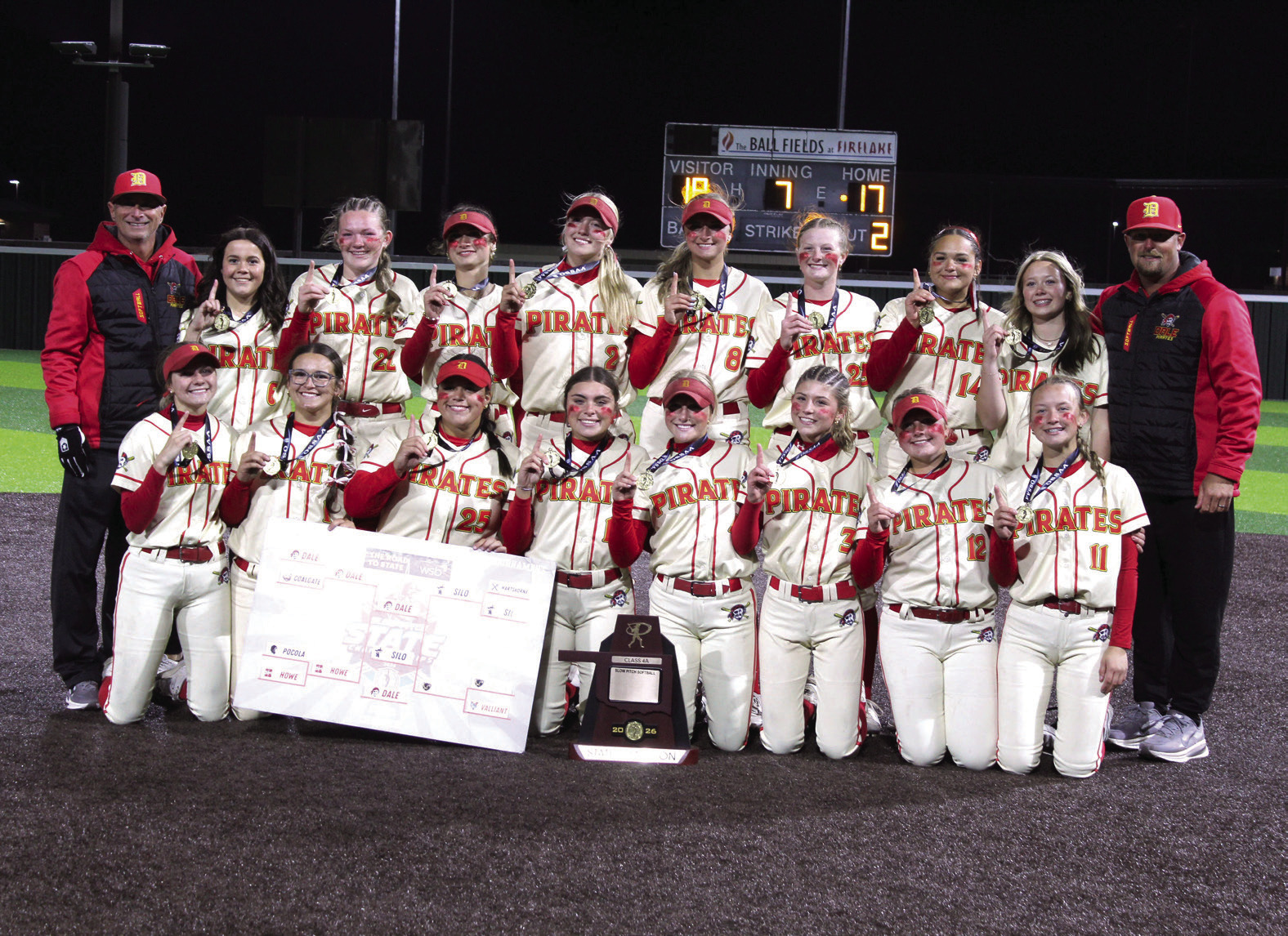 The Dale Lady Pirates and their coaches, Andy Powell, far left, and Bryce Clemmons, pose after winning the Class 4A State Slow Pitch State Championship at FireLake Ball Fields on May 5. The Lady Pirates narrowly beat Silo, 18-17, as well as Coalgate, 14-5, and Howe, 15-0. They end their season with a record of 39-4. Photos by Natasha Dunagan, Countywide &amp; Sun