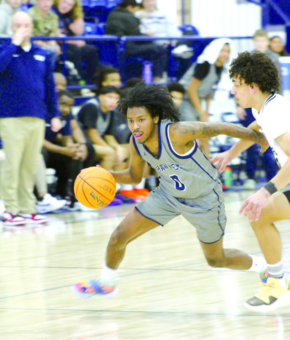 Shawnee junior Daytain Patton drives to the paint in the Jan. 18 Lowe’s/FireLake Arena Shawnee Invitational game with Broken Arrow. The Shawnee Wolves lost that game, 21-60; won the Jan. 19 game with Tahlequah, 57-49; and fell to El Reno, Jan. 20, 37-52.
