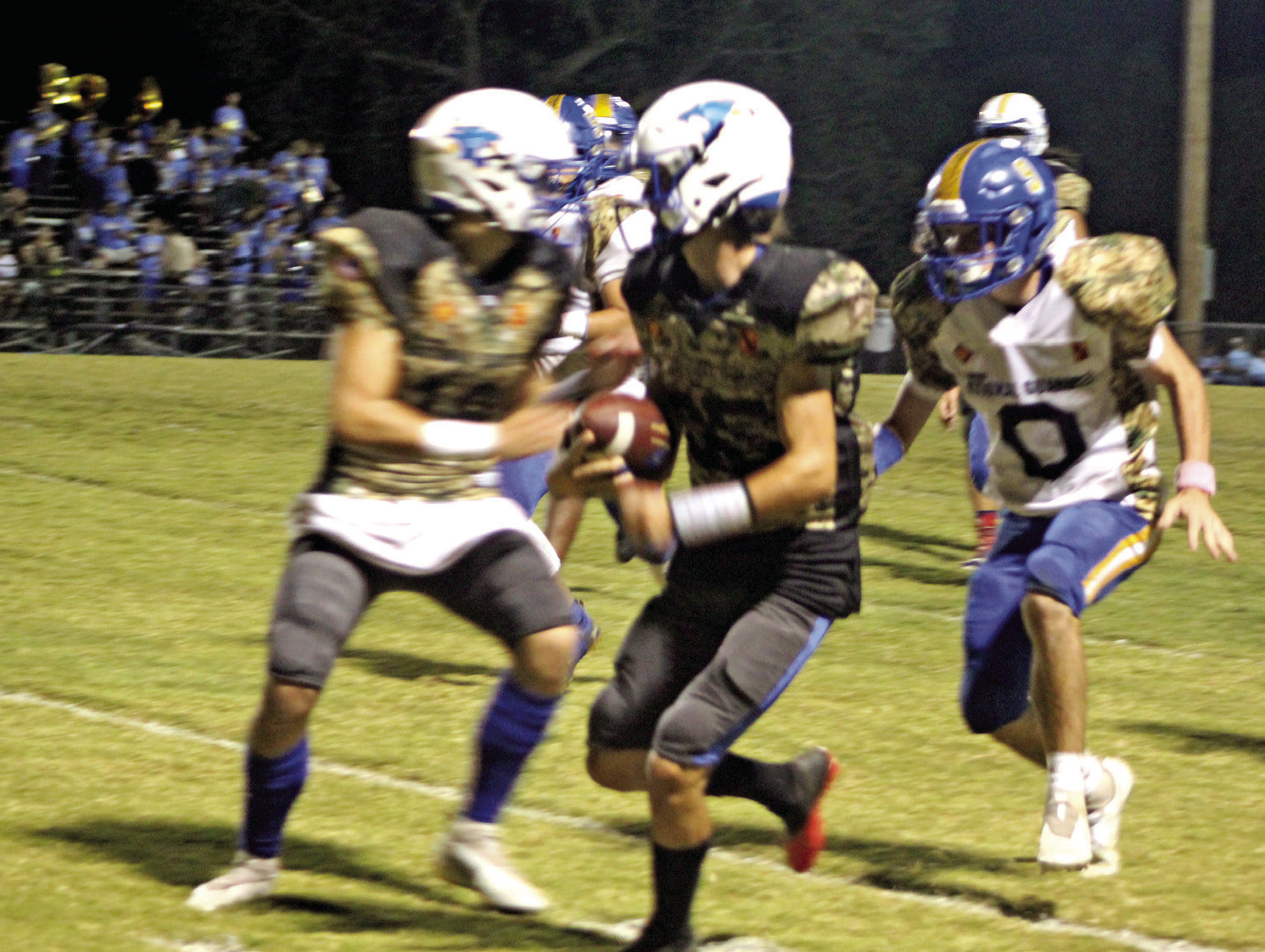 Bethel freshman Bryce Tapley tries to gain yardage along the sideline as a Holdenville player prepares to tackle him during the district home game against Holdenville on Military Night, Oct. 14, 2021. Countywide & Sun/Natasha Dunagan