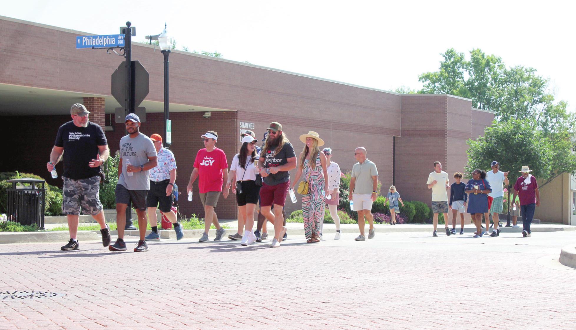 Several people walk in the Juneteenth Parade on Shawnee's Main Street, June 18. This was the second year that Juneteenth was a federal holiday, although it has been celebrated since 1866. This year's celebration also included a prayer service, history presentation, domino competition, storytelling, and a program that included musical performances, a fashion show, and speakers. Shawnee Forward also worked with the Dunbar Heights Community to hold a Pickleball Tournament at OBU. 