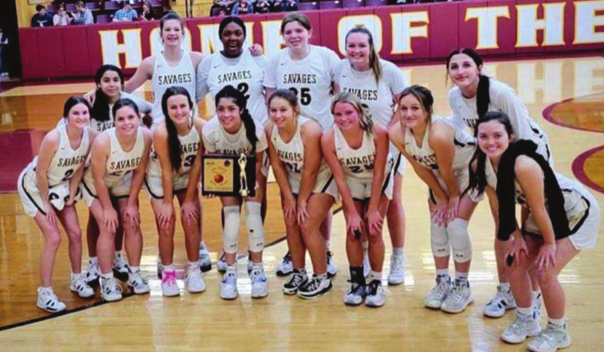 The Tecumseh Lady Savages proudly pose with their championship trophy from the Byng Tournament. Photo provided