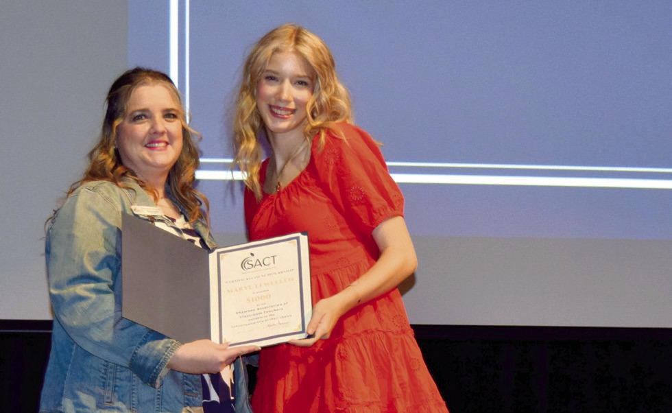 Maryl Lewellen (right), a senior at Shawnee High School, receives a Shawnee Association of Classroom Teachers Scholarship from Krista Farris, SACT president, during Monday’s Senior Awards Ceremony. Photo provided by SHS