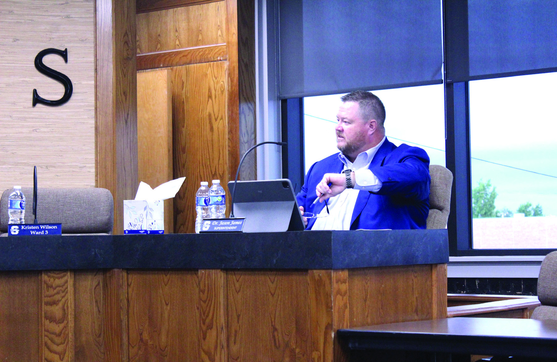 Shawnee Public Schools Superintendent Dr. Jason James poses a question about his smart watch while speaking on the new "bell-to-bell no personal wireless electronic device" policy during the SPS Board of Education meeting on June 30. Natasha Dunagan, Countywide & Sun