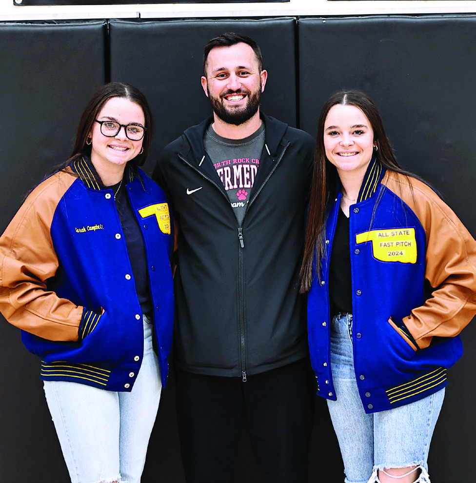 North Rock Creek's Sarah and Morgan Campbell were presented All-State Jackets for for fast pitch softball by Coach Griffen.