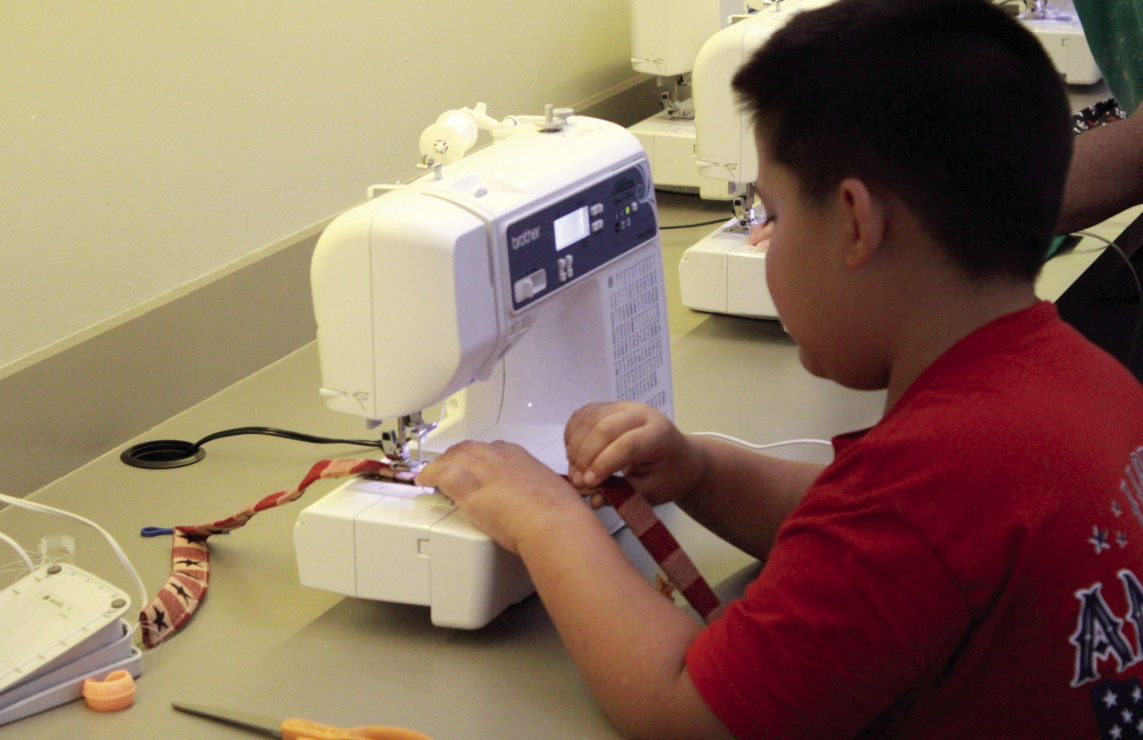 Pottawatomie County 4-H Club member Gavin Klippenstine sews a lanyard during the "Fair Project Day" meeting, held at North Rock Creek High School on Aug. 4. Kortni Perkins, 4-H educator, said they had 27 members working on projects to enter in the Pottawatomie County Free Fair. Photos courtesy of State 4-H Secretary Mason Luka