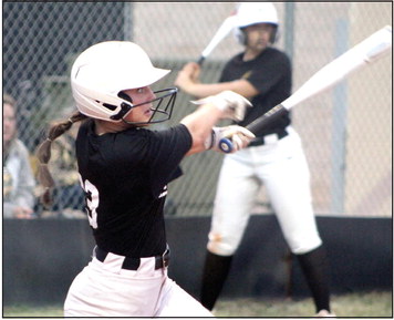 Tecumseh’s Taylor Gage hits a double in the second inning of the second home game on April 4.