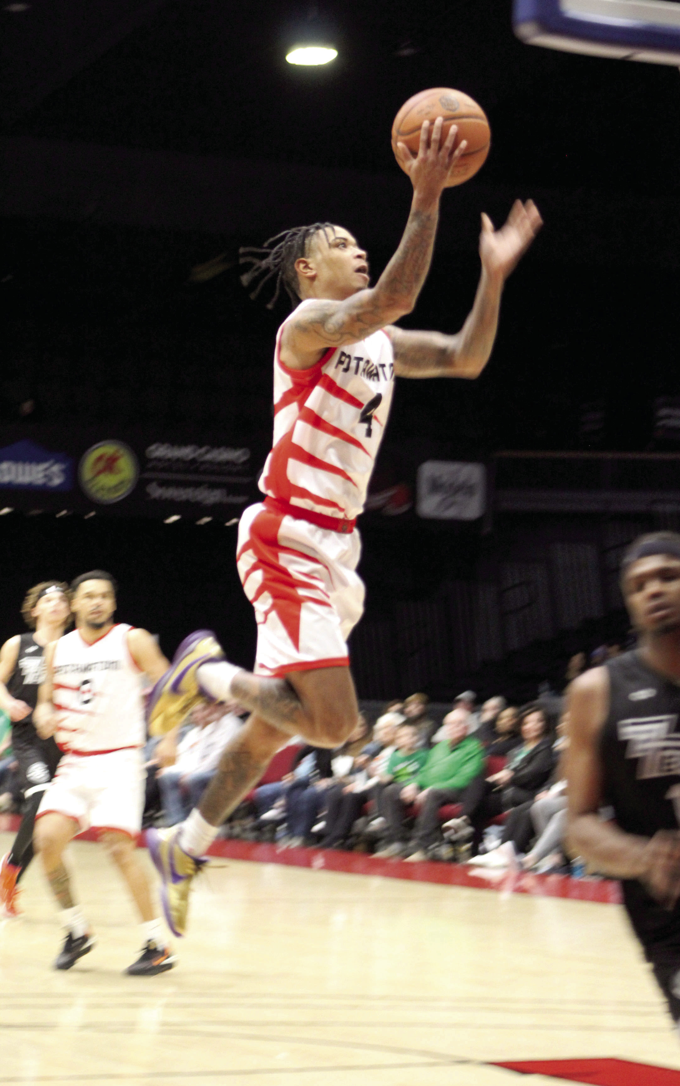 After stealing the ball, Potawatomi Fire Guard Daylon “Chuck” Guy puts one in the bucket during the third quarter of their first home game of the second season, March 17, at FireLake Arena. The Fire won against the Rockwall 7’ers, 152-96. Countywide &amp; Sun/Natasha Dunagan