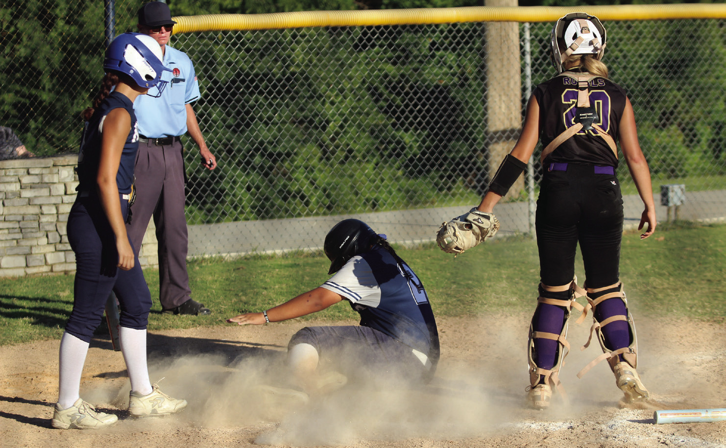 Asher freshman Raina Timms slides into home during the third inning of the home game against Community Christian School on Sept. 5. The Lady Indians won, 10-2. Countywide &amp; Sun/Natasha Dunagan