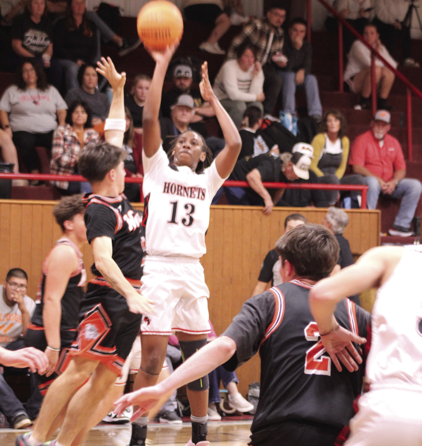 Macomb's Deandre Hendley aims for a three-pointer during the Nov. 18 home game against Wayne. The Hornets won 61-59.