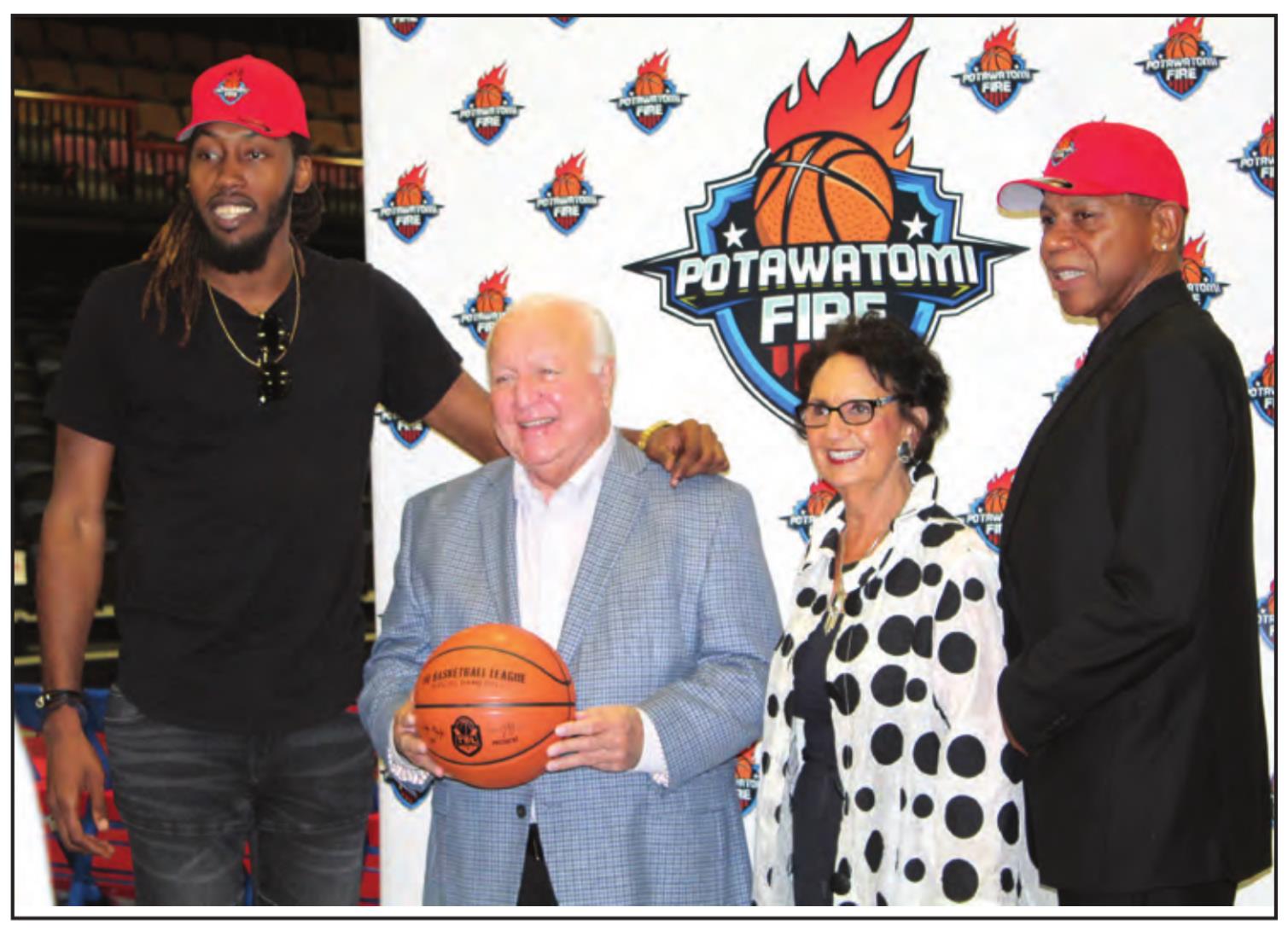 Potawatomi Fire center Anthony Allen, far left, and Head Coach Derrick Rowland, far right, pose with Citizen Potawatomi Nation Chair John “Rocky” Barrett and CPN Vice Chair Linda Capps during a press conference announcing the formation of the Potawatomi Fire by CPN and The Basketball League at FireLake Arena on Sept. 29. Countywide &amp; Sun/Natasha Dunagan