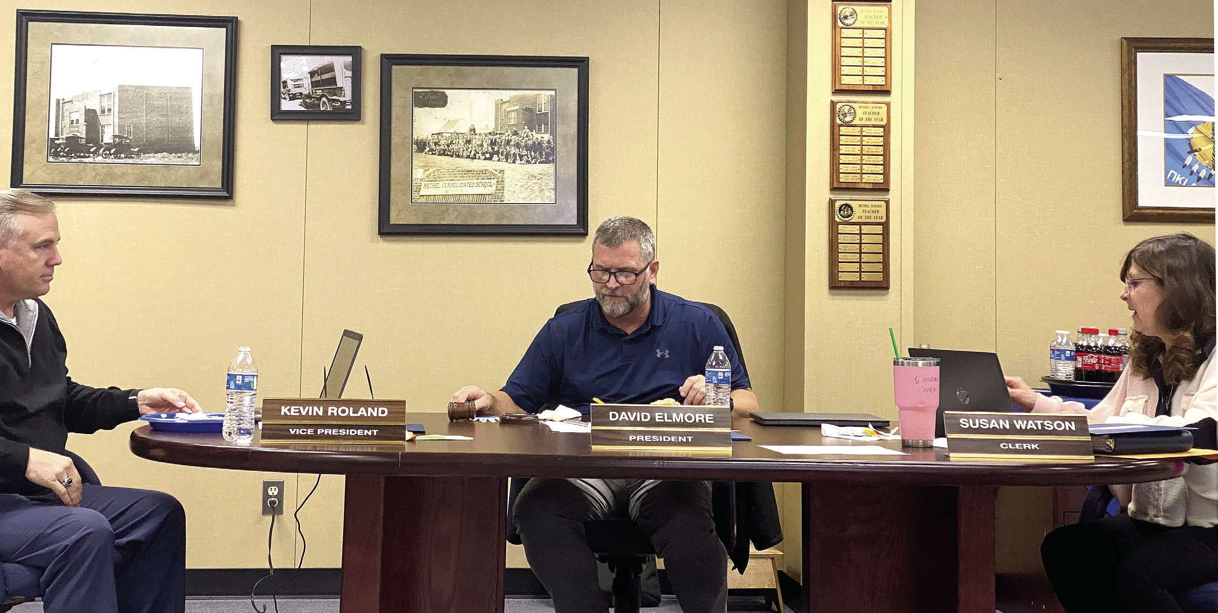 Kevin Roland (left), David Elmore (center), and Susan Watson (right) review bid information presented for the sale of bonds during the special meeting of the Bethel School Board held Monday, Jan. 23. Countywide &amp; Sun/Suzie Campbell