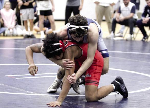 Shawnee's Ethan Soliz, in the 138-weight class, tries to take down his Del City opponent during the home dual on Jan. 8. Natasha Dunagan, Countywide &amp;amp; Sun