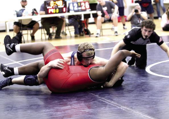 In the 215-weight class, Shawnee's Case Childers pins his opponent during the home dual against Del City on Jan. 8. Natasha Dunagan, Countywide &amp;amp; Sun