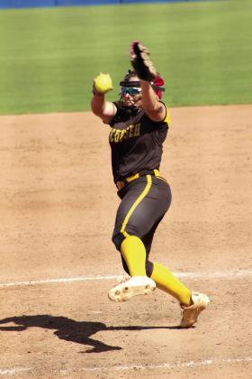 Tecumseh junior Embrie Smith balances on one toe for her pitch in the sixth inning of the Class 4A Fast Pitch State Quarterfinal game against Tuttle, held at Devon Park in OKC on Oct. 16. The Lady Savages lost, 0-5, but ended the season ranked sixth with a 29-10 record.