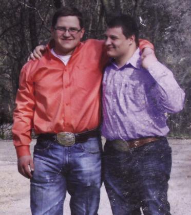 Tecumseh Agriculture Teacher Corey Pell, left, poses with his twin brother, Caleb, during their senior year of high school. Pell has been an ag teacher at Tecumseh for five years, and his father, Ray Pell, is now joining the three-person team, which also includes Mara Carman. Photo provided