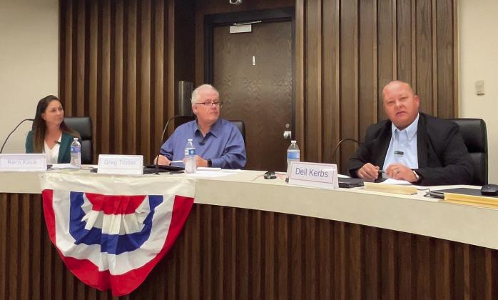 Rep. Dell Kerbs (right) addresses the audience during the forum held by the Pottawatomie Advocates for Voter Education (PAVE). Candidate Kerri Kerbs (le_) and PAVE moderator Greg Trotter (center) listen intently. Countywide &amp;amp; Sun/Suzie Campbell