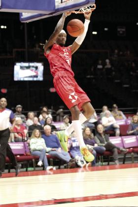 Potawatomi Fire Forward Ricky Artis II makes a slam dunk in the second quarter of the March 14 home game against the Enid Outlaws at FireLake Arena. The Fire triumphed, 150-94. Natasha Dunagan, Countywide &amp; Sun