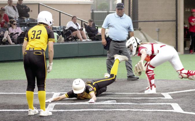 Tecumseh sophomore Madison Gray dives across home plate during the game against Shattuck in the Dale Slow Pitch Festival at FireLake Ball Fields. Natasha Dunagan, Countywide &amp; Sun