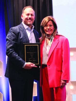 Shawnee Educational Foundation Board President Sheril Payne, right, presents the SEF Hall of Fame Award to entrepreneur and author Jeremie Kubicek during the SEF Banquet, held at OBU on March 26. Natasha Dunagan, Countywide &amp; Sun