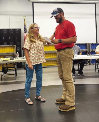 Tecumseh School Board President, Iva Bingham welcomes new board member, Shane Brown to seat #5. Brown replaces Todd Kennedy, who resigned in May. Countywide &amp;amp; Sun/Julie Talton