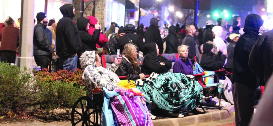 A large crowd came out to watch the 108 float entries in the Shawnee Parade of Lights on Dec. 13 amid the cold, mist and wind. File photo