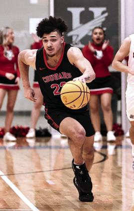 Nor th Rock Creek's Caleb Hawkins steals the ball and drives to the bucket. Photo courtesy of Gowin Photography