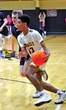 Tecumseh’s Jace Edwards takes the ball down the court during the homecoming game against Little Axe on Jan. 28. The Savages won 72-35. Countywide &amp;amp; Sun/Suzie Campbell