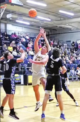 Tecumseh’s Brennan Carter makes his shot during the homecoming game against Little Axe