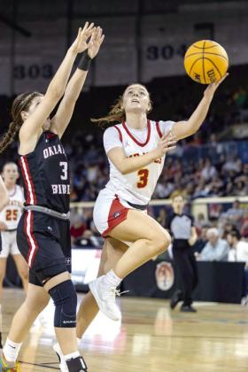 Dale's Skylar Anderson goes to the bucket with a wide layup shot.