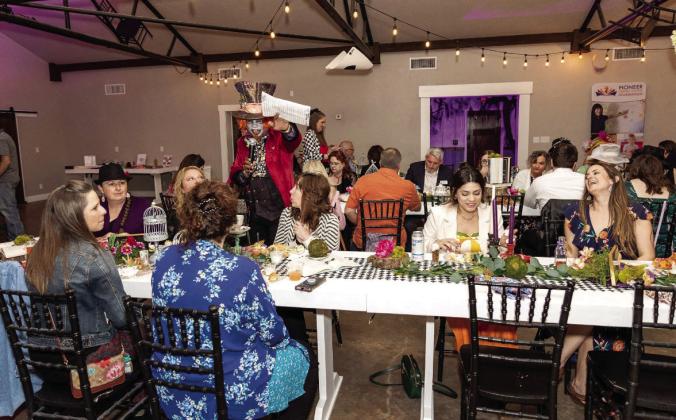 The Mad Hatter entertains guests at the Pioneer Library System Foundation’s inaugural Enter Into Our Wonderland: A Mad Hatter Tea Party event on March 30, 2023, at the Lakeside Wedding Venue in Shawnee. Photo by Greta Shuler