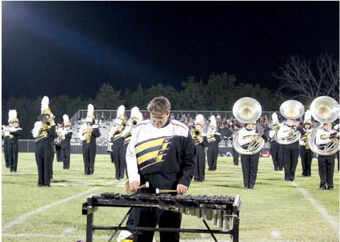 Shaun Pontius plays xylophone with the Tecumseh High School Savage Pride Marching Band during halftime of the first home football game on Sept. 1. The THS band is playing songs from the Beatles this year. Countywide &amp;amp; Sun/Natasha Dunagan
