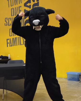 Victor Cope models a panther mascot in his continued quest of encouraging the board to reconsider the savage name. He reminded them that as long as a “savage” was the mascot, the school could never have a cute mascot such as this. Countywide &amp; Sun/Julie Talton